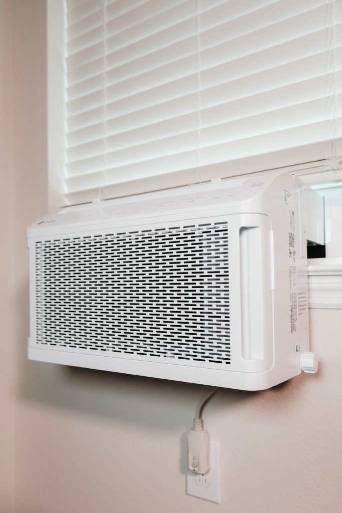 Wall-mounted split air conditioner installed in a home